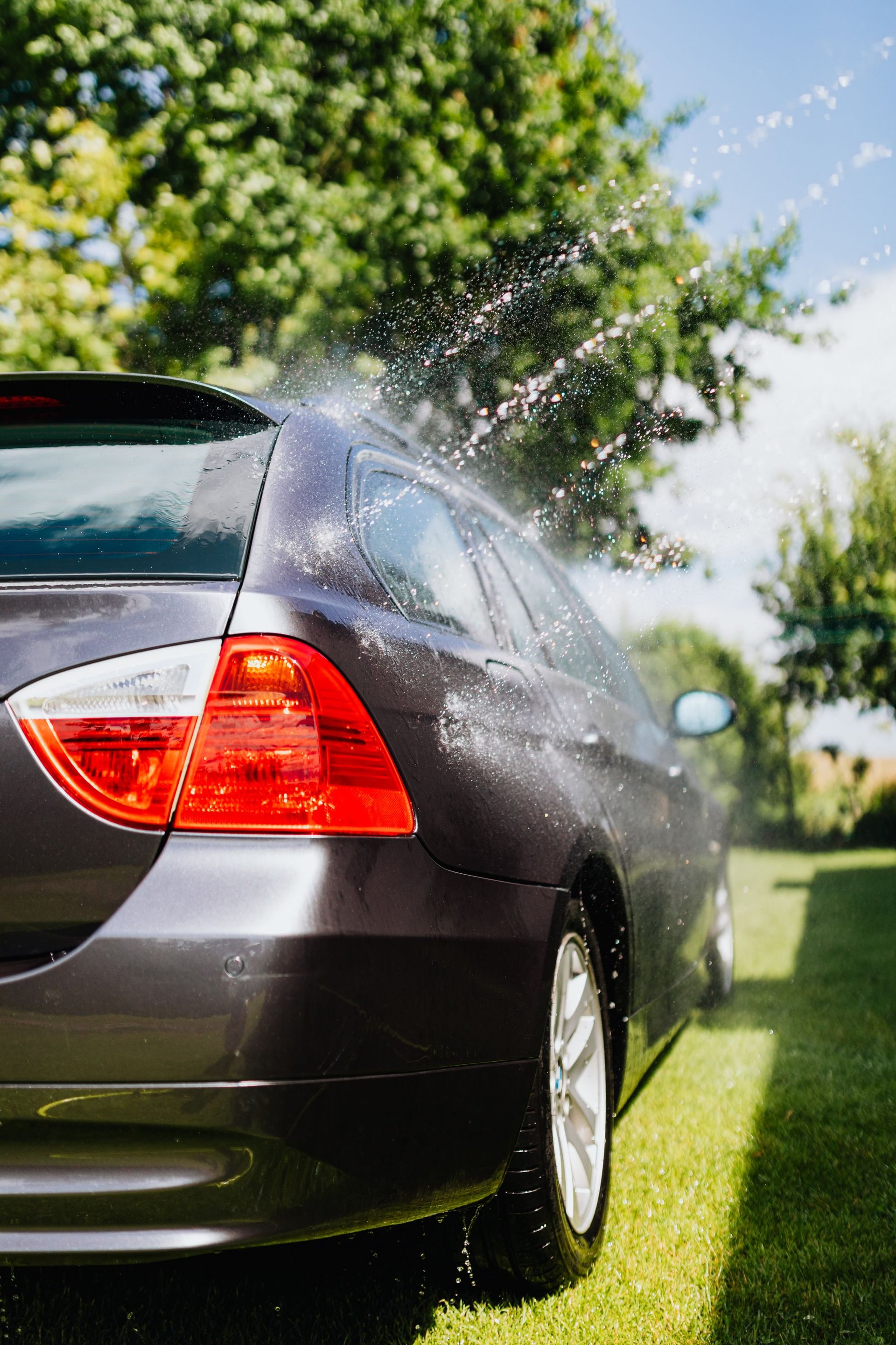 A Detailed team member cleaning vehicles at a dealership